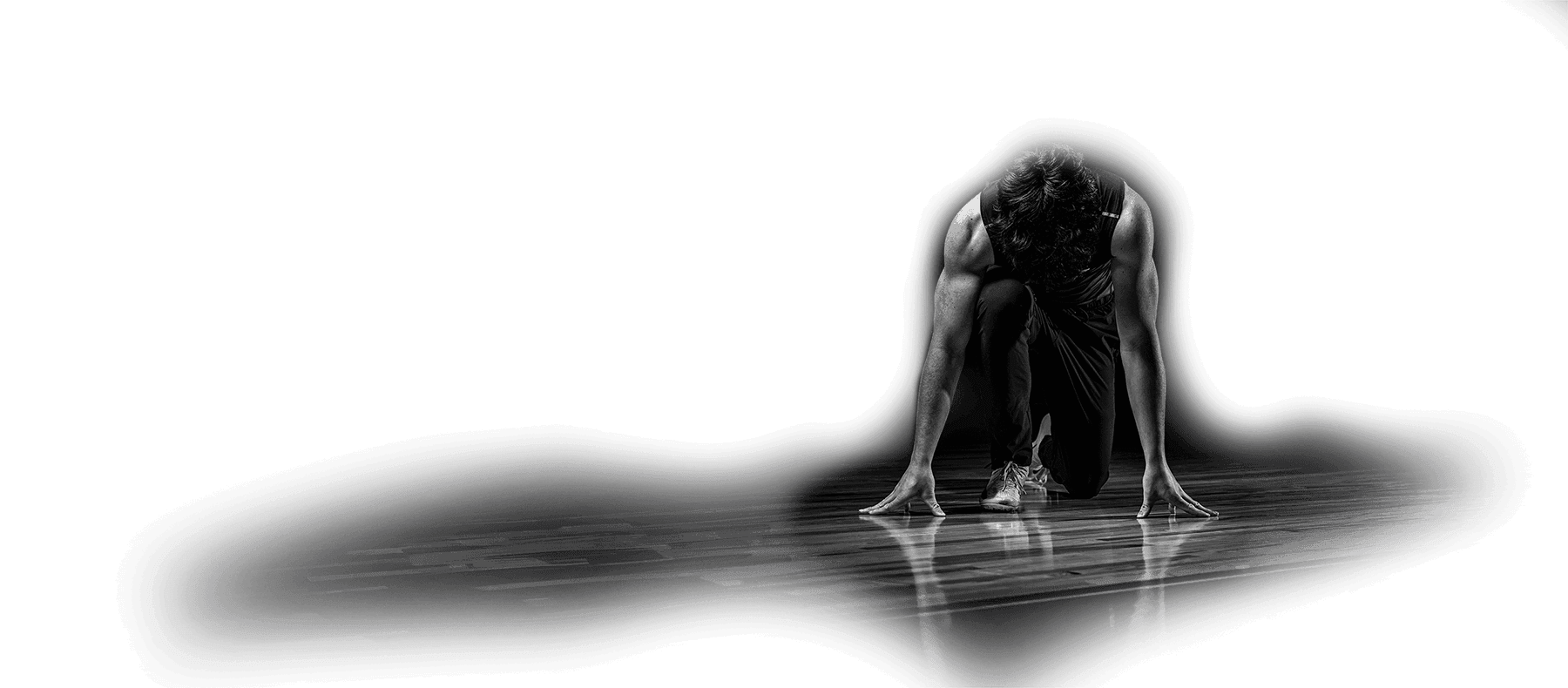 Běžec připraven ke sprintu v zákleku do bloku.